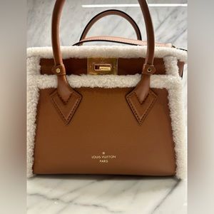 Authentic Louis Vuitton leather and shearling purse.